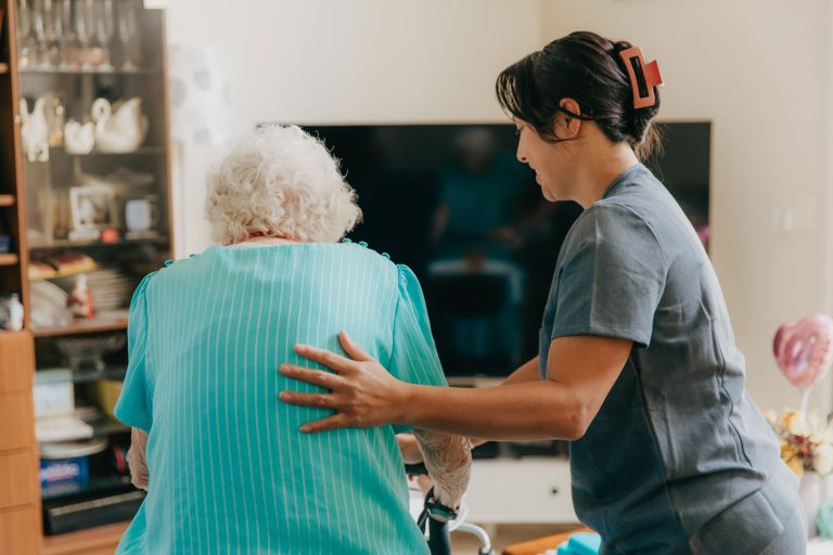 Home Care Provider On The Gold Coast Assisting An Elderly Woman